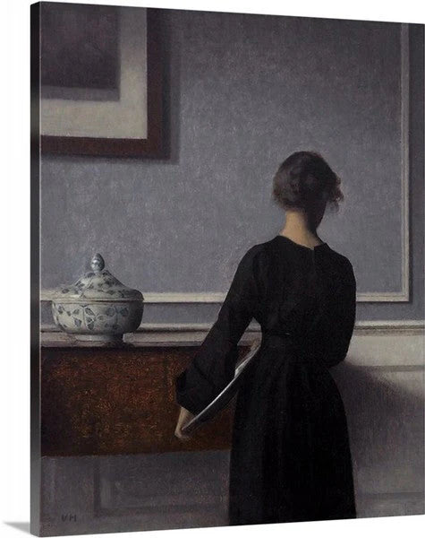 Vilhelm Hammershøi - Interior con una joven vista de espaldas (1904)