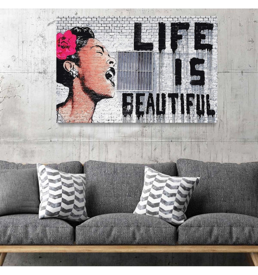 Cuadro life is beautiful de Banksy colgado en la sala